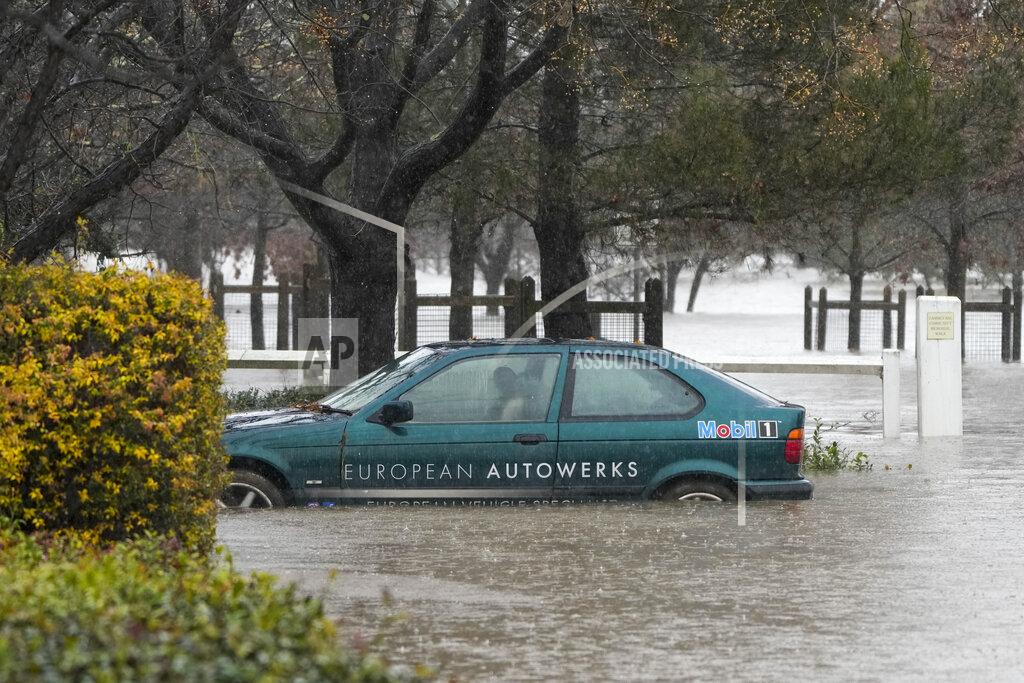 Mark Baker A car lies semi submerged in flood waters at Camden on the outskirts of Sydney, Australia, Monday, July 4, 2022. More than 30,000 residents of Sydney and its surrounds have been told to evacuate or prepare to abandon their homes on Monday as Australia’s largest city braces for what could be its worst flooding in 18 months. (AP Photo/Mark Baker)