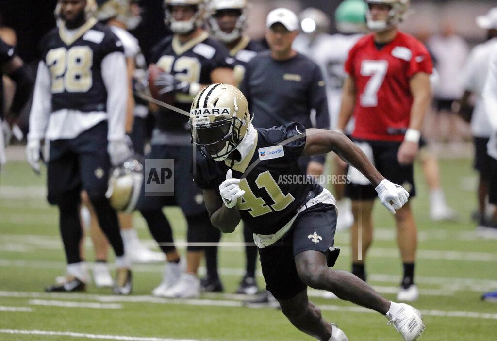 FILE - In this Tuesday, June 11, 2019, file photo, New Orleans Saints running back Alvin Kamara (41) runs a drill during NFL football practice in Metairie, La. Kamara says the offseason is a time for him to experiment with training methods and nutrition to improve as an athlete, and to continue studying pro football in hopes of adding new wrinkles to his already dynamic game. (AP Photo/Gerald Herbert, File)