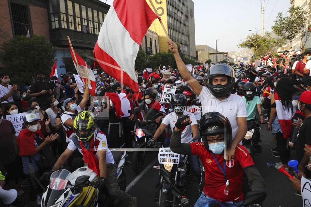 Rodrigo Abd A caravan of demonstrators on motorcycles ride after interim President Manuel Merino resigned his post, in Lima, Peru, Sunday, Nov. 15, 2020. Merino announced his resignation following massive protests, unleashed when lawmakers ousted President Martin Vizcarra. (AP Photo/Rodrigo Abd)