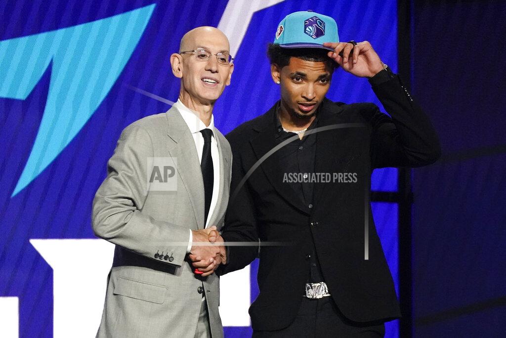 Corey Sipkin James Bouknight, right, poses for a photo with NBA Commissioner Adam Silver after being selected 11th overall by the Charlotte Hornets during the NBA basketball draft, Thursday, July 29, 2021, in New York. (AP Photo/Corey Sipkin)