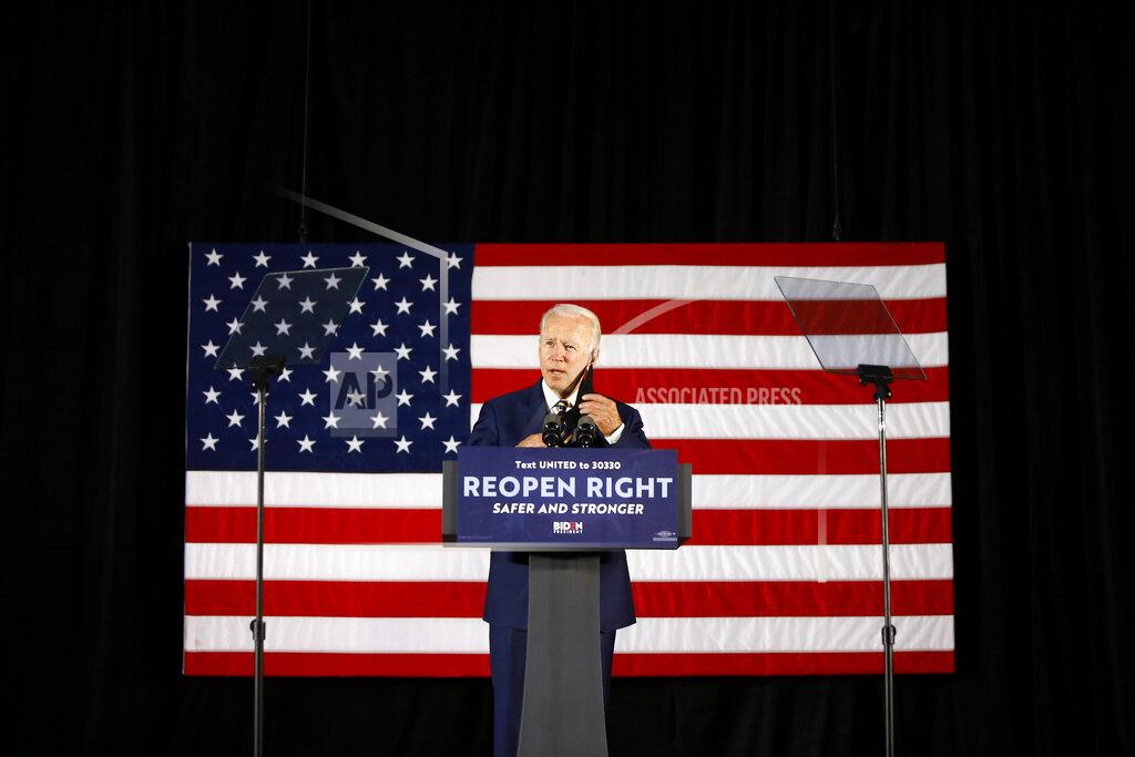 Matt Slocum Democratic presidential candidate former Vice President Joe Biden removes his mask while speaking Wednesday, June 17, 2020, in Darby, Pa. (AP Photo/Matt Slocum)