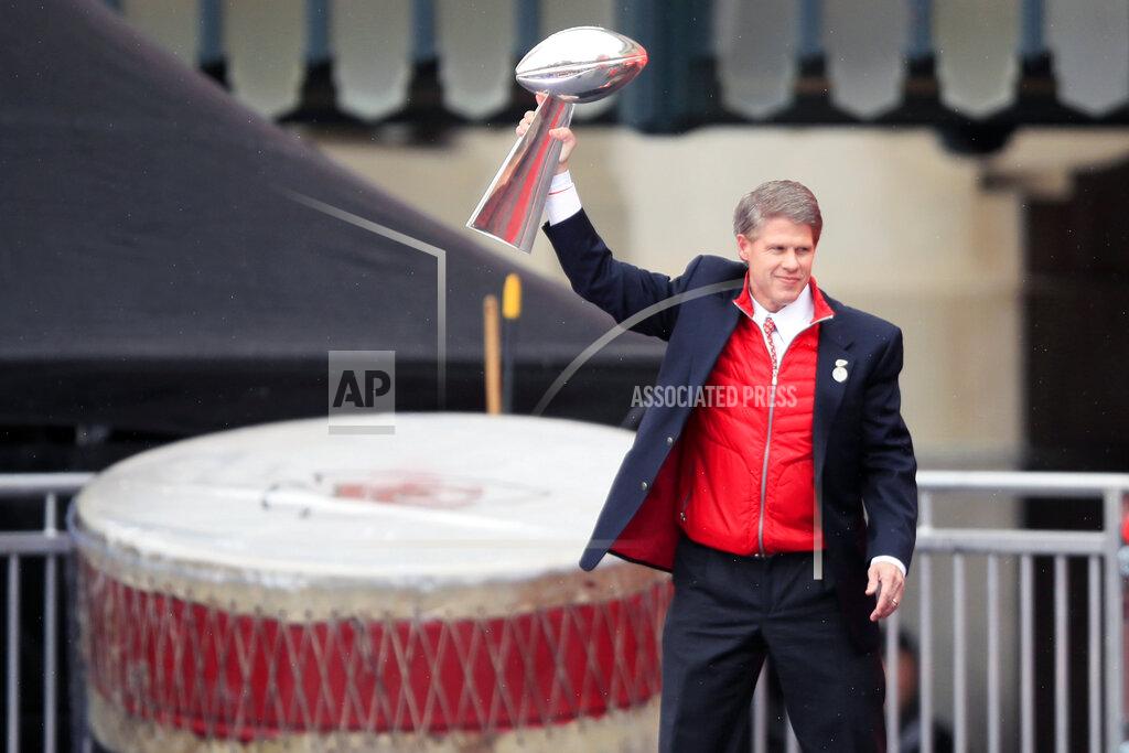 Kansas City Chiefs owner Clark Hunt holds the Super Bowl trophy during a rally in Kansas City, Mo., Wednesday, Feb. 5, 2020. (AP Photo/Orlin Wagner)