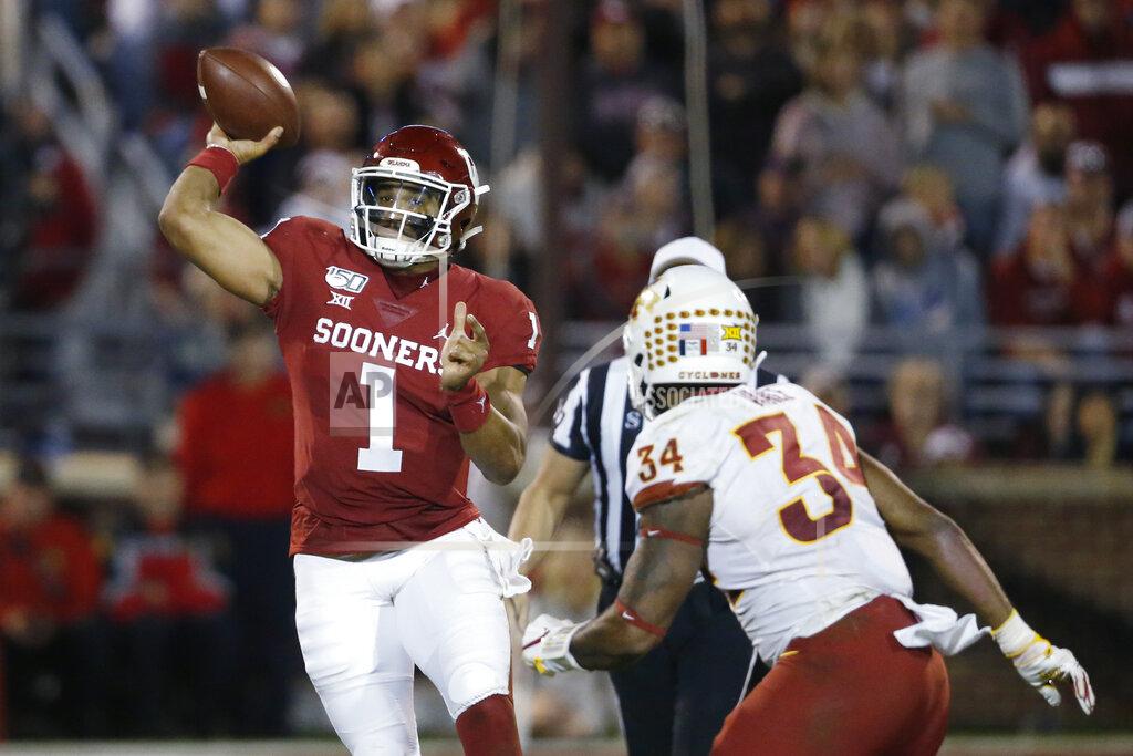 Oklahoma quarterback Jalen Hurts (1) throws under pressure from Iowa State linebacker O'Rien Vance (34) during the third quarter of an NCAA college football game in Norman, Okla., Saturday, Nov. 9, 2019. (AP Photo/Sue Ogrocki)