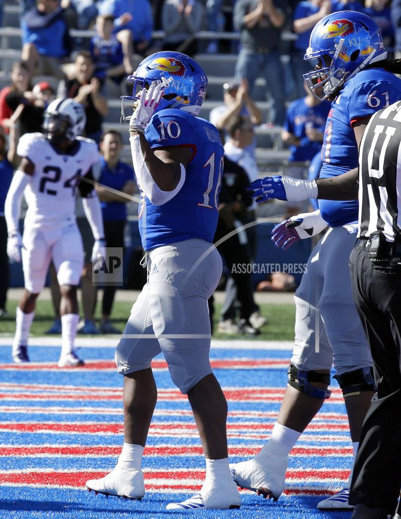 Orlin Wagner Kansas running back Khalil Herbert (10) celebrates a touchdown with Kansas offensive lineman Malik Clark (61) during the first half of an NCAA college football game against TCU in Lawrence, Kan., Saturday, Oct. 27, 2018. (AP Photo/Orlin Wagner)