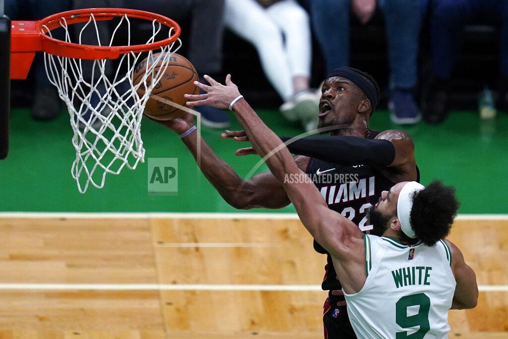 Charles Krupa Boston Celtics guard Derrick White (9) pressures Miami Heat forward Jimmy Butler (22) on a shot during the first half of Game 4 of the NBA basketball playoffs Eastern Conference finals, Monday, May 23, 2022, in Boston. (AP Photo/Charles Krupa)