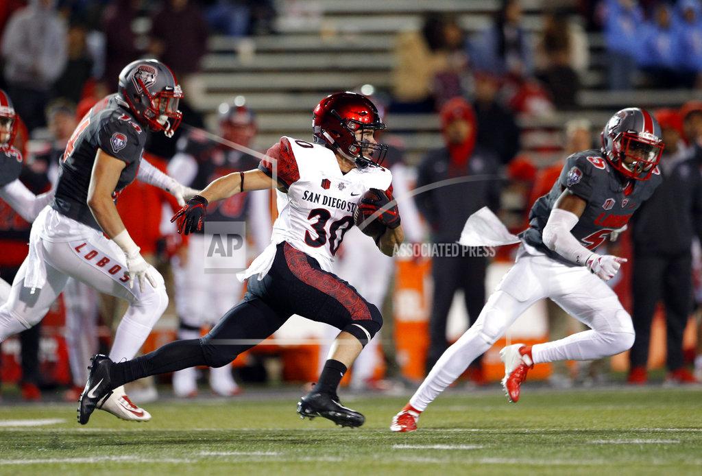 Andres Leighton San Diego State cornerback Garrett Binkley (30) runs for yardage on a kickoff return followed by New Mexico safeties Michael Sewell (5) and Gabe Ortega (14) during the second half of an NCAA college football game in Albuquerque, N.M., Saturday, Nov. 3, 2018. San Diego State won 31-23. (AP Photo/Andres Leighton)