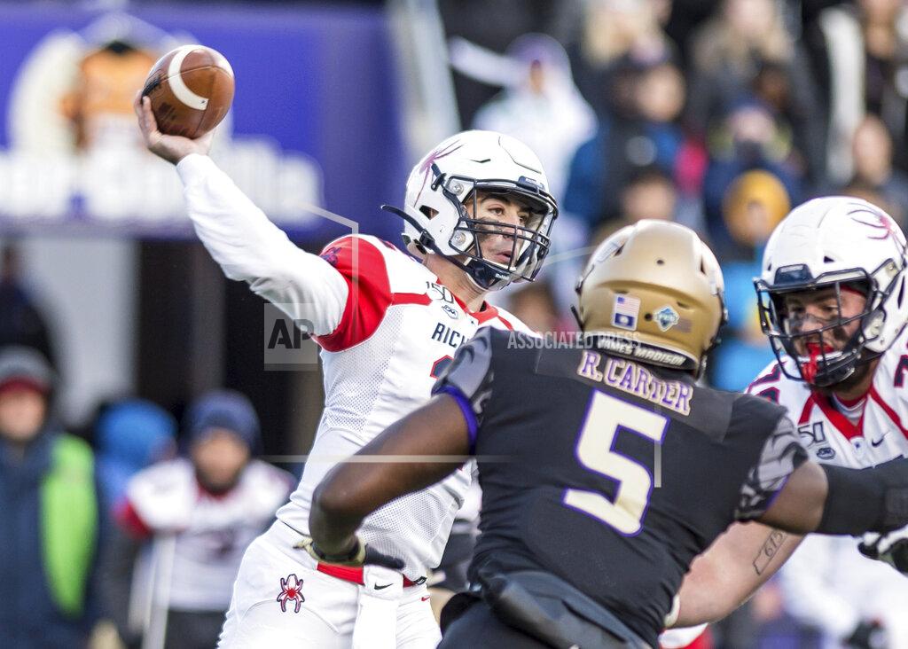 Daniel Lin Richmond quarterback Joe Mancuso (12) fires off a pass under pressure from James Madison defensive lineman Ron'Dell Carter (5) during the first half of an NCAA football game in Harrisonburg, Va, Saturday, Nov. 16, 2019. (Daniel Lin/Daily News-Record via AP)