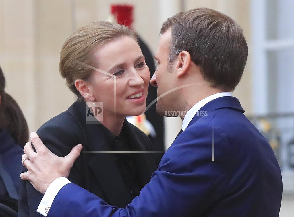 Denmark's Prime Minister Mette Fredriksen, left, is welcomed by French President Emmanuel Macron for a lunch at the Elysee Palace in Paris, Monday, Nov. 18, 2019. Denmark's Prime Minister Mette Fredriksen is in Paris for bilateral talks. (AP Photo/Michel Euler)