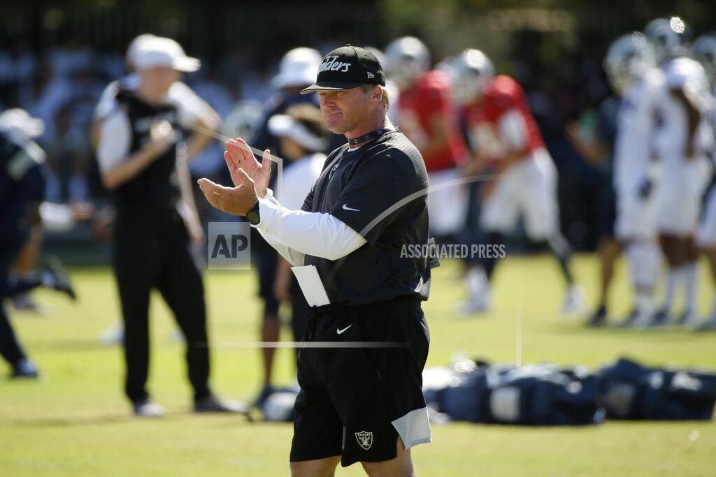 FILE - In this Aug. 8, 2019, file photo, Raiders head coach Jon Gruden claps during a combined NFL football training camp with the Rams, in Napa, Calif. Commissioner Roger Goodell told the 32 NFL clubs on Thursday, June 4, 2020, that coaching staffs are allowed to return to team facilities starting Friday. (AP Photo/Eric Risberg, File)