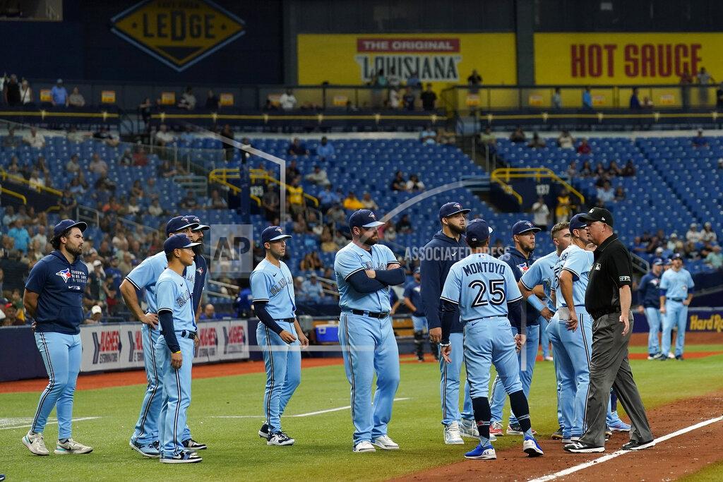 Chris O'MEara Toronto Blue Jays players and coach stand on the field after Blue Jays pitcher Ryan Borucki hit Tampa Bay Rays' Kevin Kiermaier with a pitch during the eighth inning of a baseball game Wednesday, Sept. 22, 2021, in St. Petersburg, Fla. (AP Photo/Chris O'Meara)
