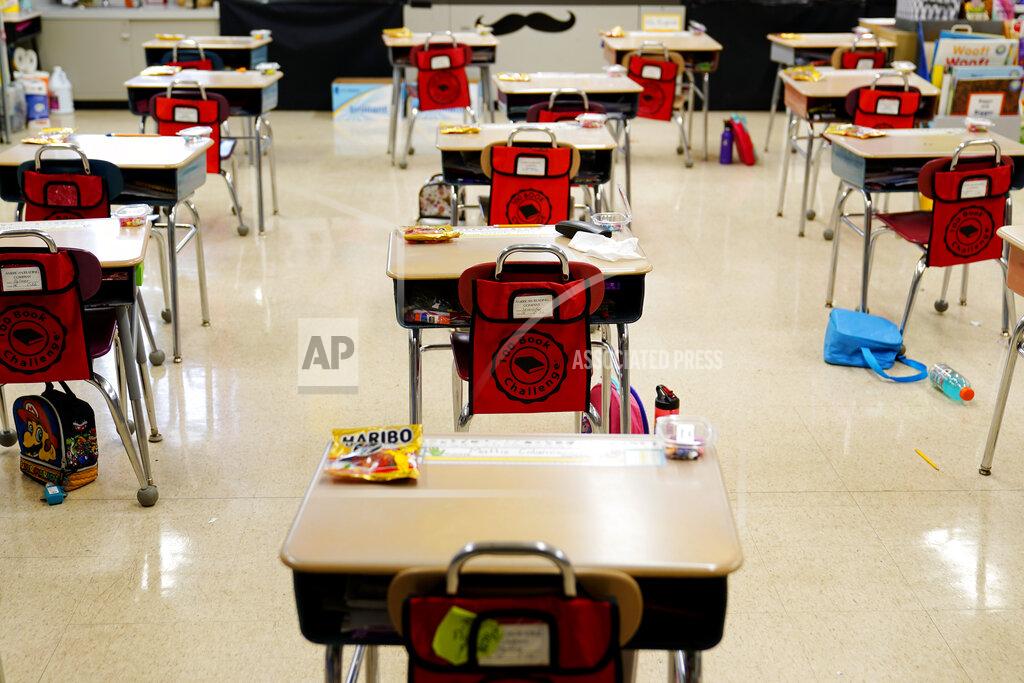 Matt Slocum Desks are arranged in a classroom at Panther Valley Elementary School, Thursday, March 11, 2021, in Nesquehoning, Pa. On May 26, 2020, former student, 9-year-old Ava Lerario; her mother, Ashley Belson, and her father, Marc Lerario were found fatally shot inside their home. (AP Photo/Matt Slocum)