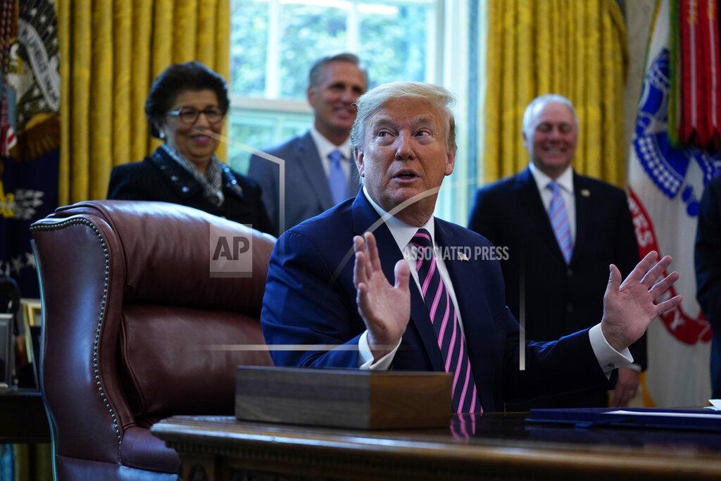 Evan Vucci President Donald Trump speaks after signing a coronavirus aid package to direct funds to small businesses, hospitals, and testing, in the Oval Office of the White House, Friday, April 24, 2020, in Washington. (AP Photo/Evan Vucci)