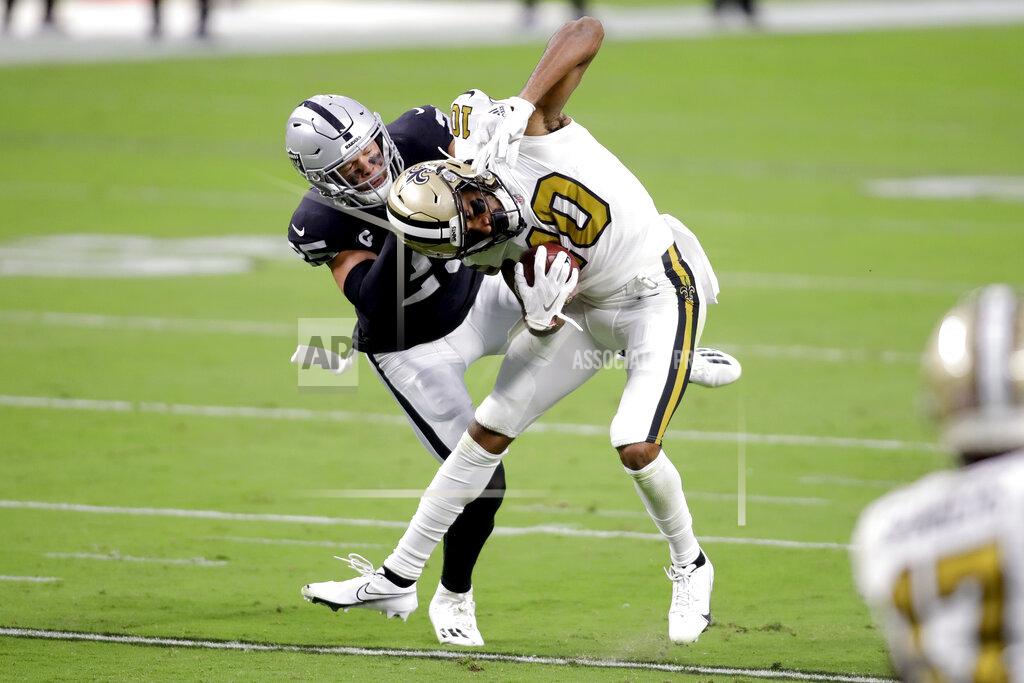 Isaac Brekken New Orleans Saints wide receiver Tre'Quan Smith (10) breaks a tackle from Las Vegas Raiders free safety Erik Harris during the first half of an NFL football game, Monday, Sept. 21, 2020, in Las Vegas. (AP Photo/Isaac Brekken)