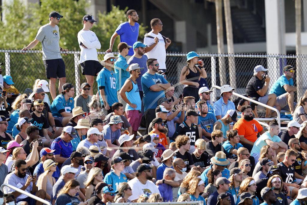 John Raoux Fans pack bleachers as they watch the Jacksonville Jaguars NFL football practice, Saturday, July 31, 2021, in Jacksonville, Fla. (AP Photo/John Raoux)