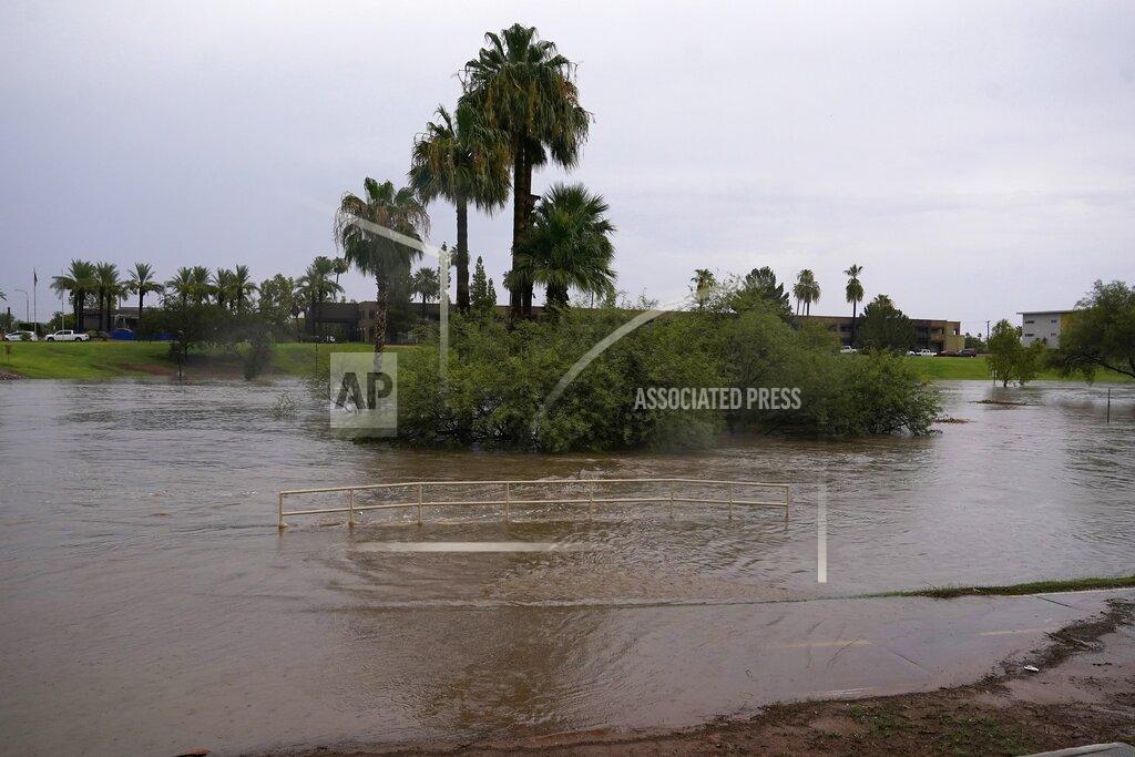 Ross D. Franklin Heavy rains caused flooding at Vista del Camino Park, Friday, July 23, 2021, in Scottsdale, Ariz. (AP Photo/Ross D. Franklin)