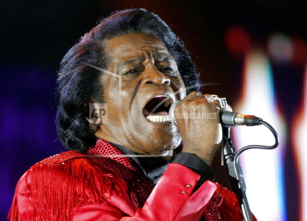 Matt Dunham FILE - In this July 6, 2005 file photo, James Brown performs on stage during the Live 8 concert at Murrayfield Stadium in Edinburgh, Scotland. The family of entertainer James Brown has reached a settlement ending a 15-year battle over late singer’s estate. David Black, an attorney representing Brown’s estate, confirmed to The Associated Press on Friday, July 23, 2021 that the agreement was reached July 9. (AP Photo/Matt Dunham, File)