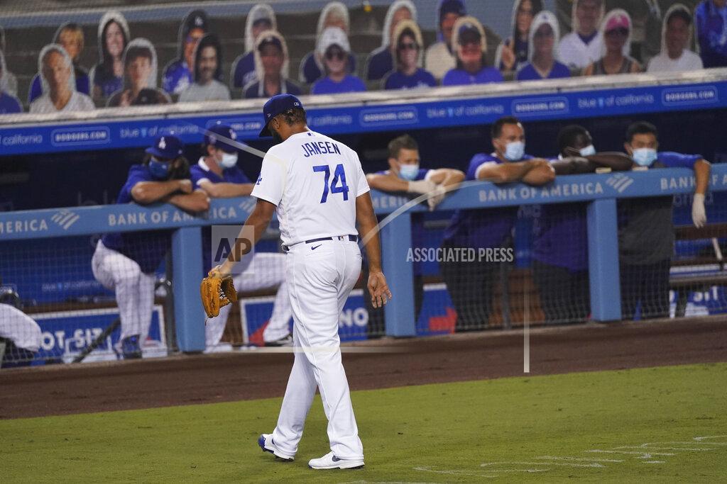 Ashley Landis Los Angeles Dodgers relief pitcher Kenley Jansen returns to the dugout after giving up five runs to the Houston Astros during the ninth inning of a baseball game at Dodger Stadium on Saturday, Sept. 12, 2020, in Los Angeles. (AP Photo/Ashley Landis)