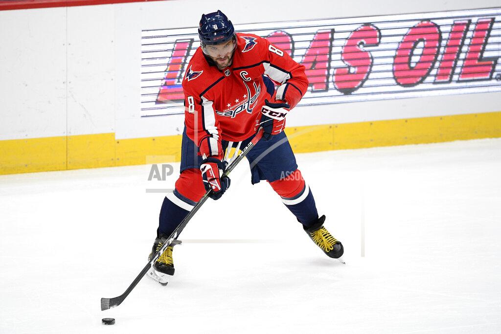 Nick Wass Washington Capitals left wing Alex Ovechkin (8), of Russia, skates with the puck during the second period of an NHL hockey game against the Boston Bruins, Saturday, Jan. 30, 2021, in Washington. (AP Photo/Nick Wass)