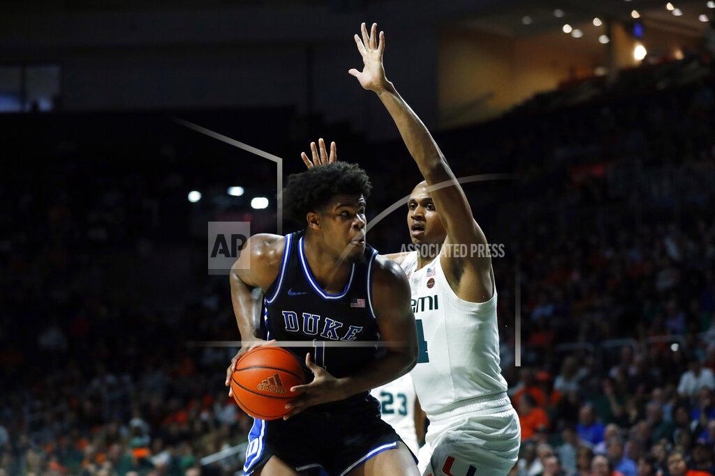 Wilfredo Lee Duke forward Vernon Carey Jr. (1) looks for an opening past Miami center Rodney Miller Jr. (14) during the second half of an NCAA college basketball game, Saturday, Jan. 4, 2020, in Coral Gables, Fla. (AP Photo/Wilfredo Lee)