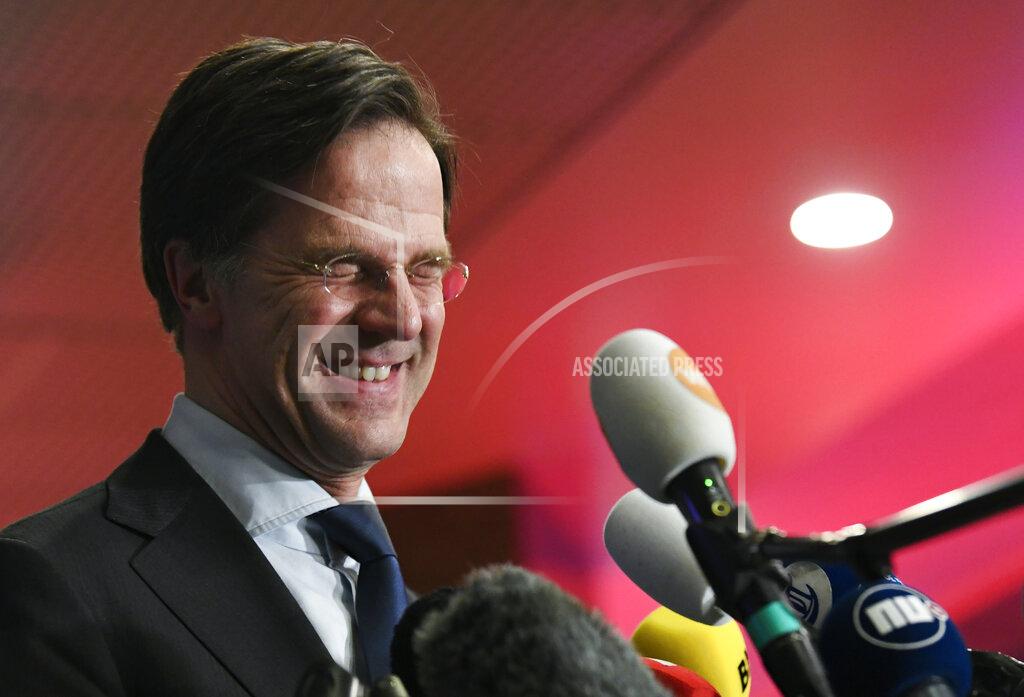 Piroschka Van De Wouw Dutch caretaker Prime Minister Mark Rutte speaks with the media following exit polls in the general election in The Hague, Netherlands, March 17, 2021. Dutch voters pushed Rutte towards a fourth term in office in a general election Wednesday, bolstering his conservative party's position as the biggest in parliament and boosting a key ally into second place, an exit poll suggested. (Piroschka van de Wouw/Pool via AP)