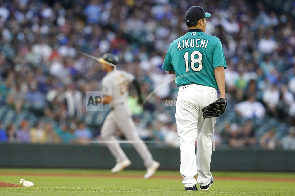 Ted S. Warren Seattle Mariners starting pitcher Yusei Kikuchi (18) waits as Oakland Athletics' Matt Olson, left, rounds the bases after hitting a solo home run during the fourth inning of a baseball game Friday, July 23, 2021, in Seattle. (AP Photo/Ted S. Warren)