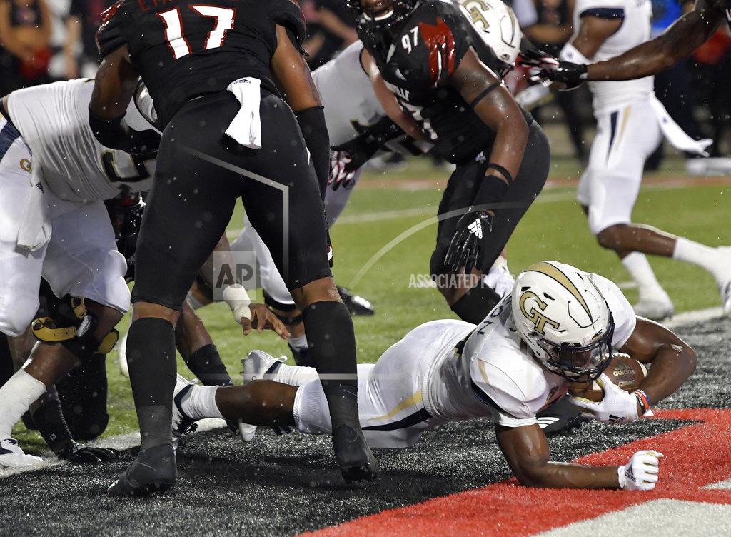 Timothy D. Easley Georgia Tech running back Jordan Mason (24) busts through the Louisville line to score a touchdown during the first half of an NCAA college football game, Friday, Oct. 5, 2018, in Louisville, Ky. (AP Photo/Timothy D. Easley)