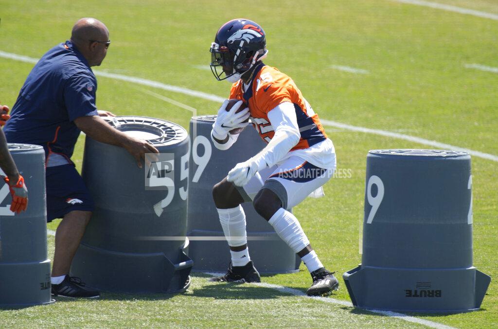 David Zalubowski Denver Broncos running back Melvin Gordon, right, takes part in drills during a mandatory minicamp at the NFL team's training headquarters Tuesday, June 15, 2021, in Englewood, Colo. (AP Photo/David Zalubowski)