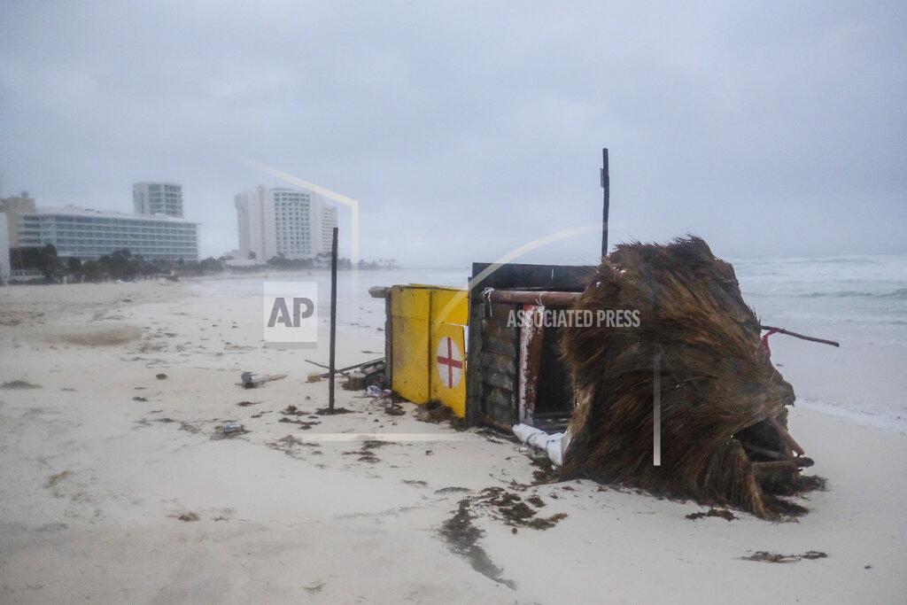Victor Ruiz Garcia A lifeguard tower lays on its side after it was toppled over by Hurricane Delta in Cancun, Mexico, early Wednesday, Oct. 7, 2020. Hurricane Delta made landfall Wednesday just south of the Mexican resort of Cancun as a Category 2 storm, downing trees and knocking out power to some resorts along the northeastern coast of the Yucatan Peninsula. (AP Photo/Victor Ruiz Garcia)