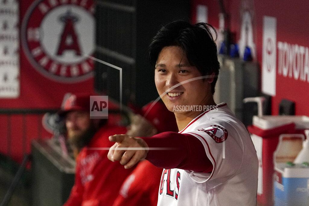 Mark J. Terrill Los Angeles Angels designated hitter Shohei Ohtani gestures to other players in the dugout during the first inning of a baseball game against the Houston Astros Thursday, Sept. 23, 2021, in Anaheim, Calif. (AP Photo/Mark J. Terrill)