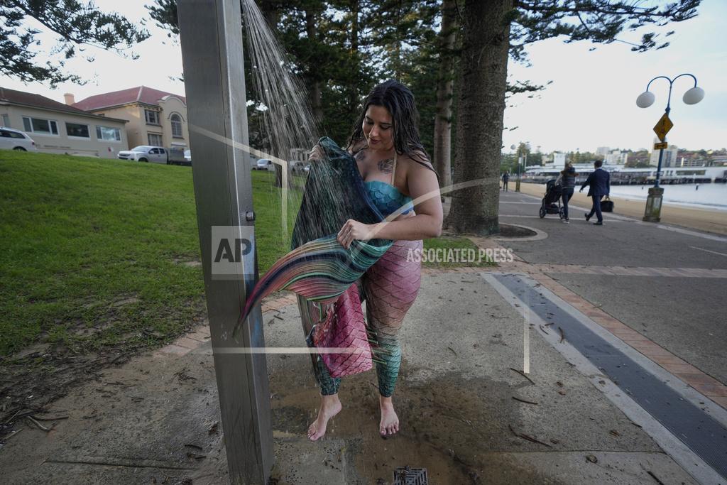 Mark Baker Lauren Metzler, founder of Sydney Mermaids, washes her tail after a swim at Manly Cove Beach in Sydney, Australia, Thursday, May 26, 2022. Across the world, people are increasingly embracing the subculture of “mermaiding.” At its simplest, these are humans of all genders, shapes and backgrounds who enjoy dressing up as mermaids. (AP Photo/Mark Baker)