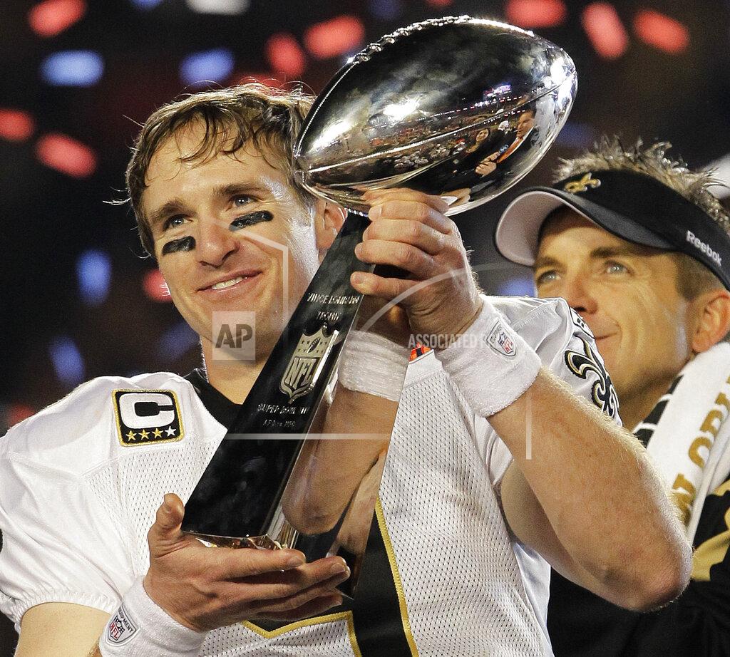 Julie Jacobson FILE - In this Feb. 7, 2010, file photo, New Orleans Saints quarterback Drew Brees celebrates with the Vince Lombardi Trophy after the Saints' 31-17 win over the Indianapolis Colts in the NFL Super Bowl XLIV football game in Miami. As part of its celebration of its 100th season, the NFL is designating a Game of the Week, each chosen to highlight a classic matchup. For this week, it is the Colts-Saints game. (AP Photo/Julie Jacobson, File)