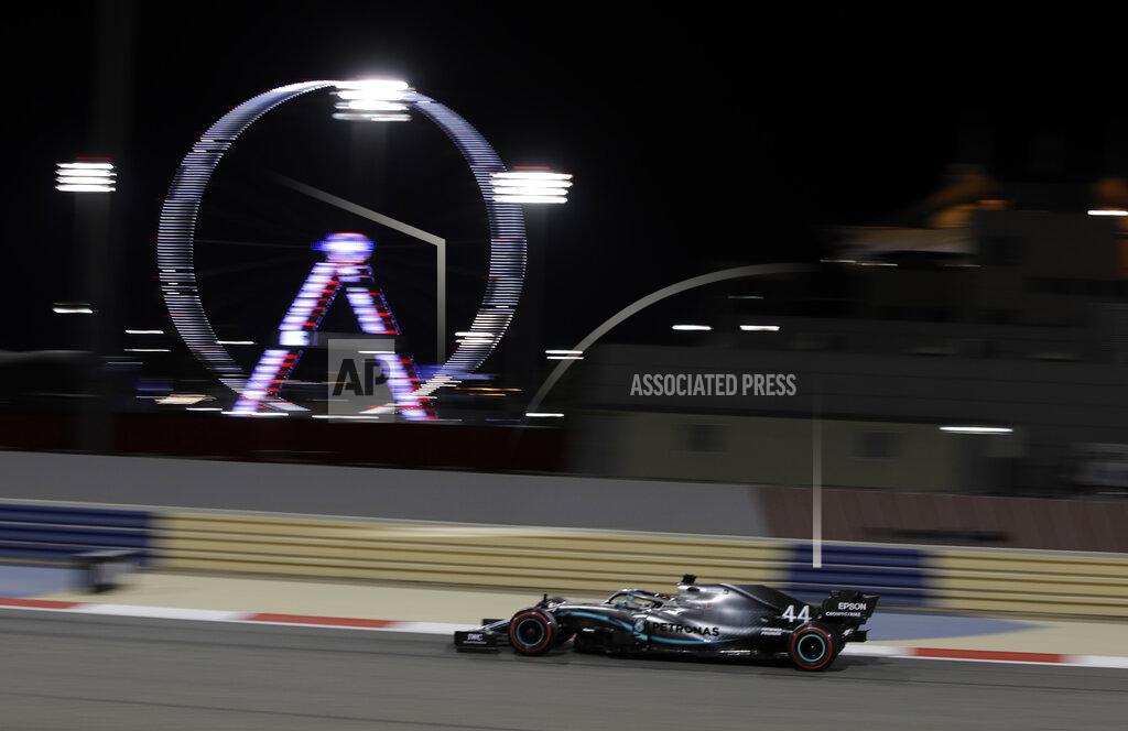Luca Bruno Mercedes driver Lewis Hamilton of Britain steers his car during qualifying session at the Formula One Bahrain International Circuit in Sakhir, Bahrain, Saturday, March 30, 2019. The Bahrain Formula One Grand Prix will take place on Sunday. (AP Photo/Luca Bruno)