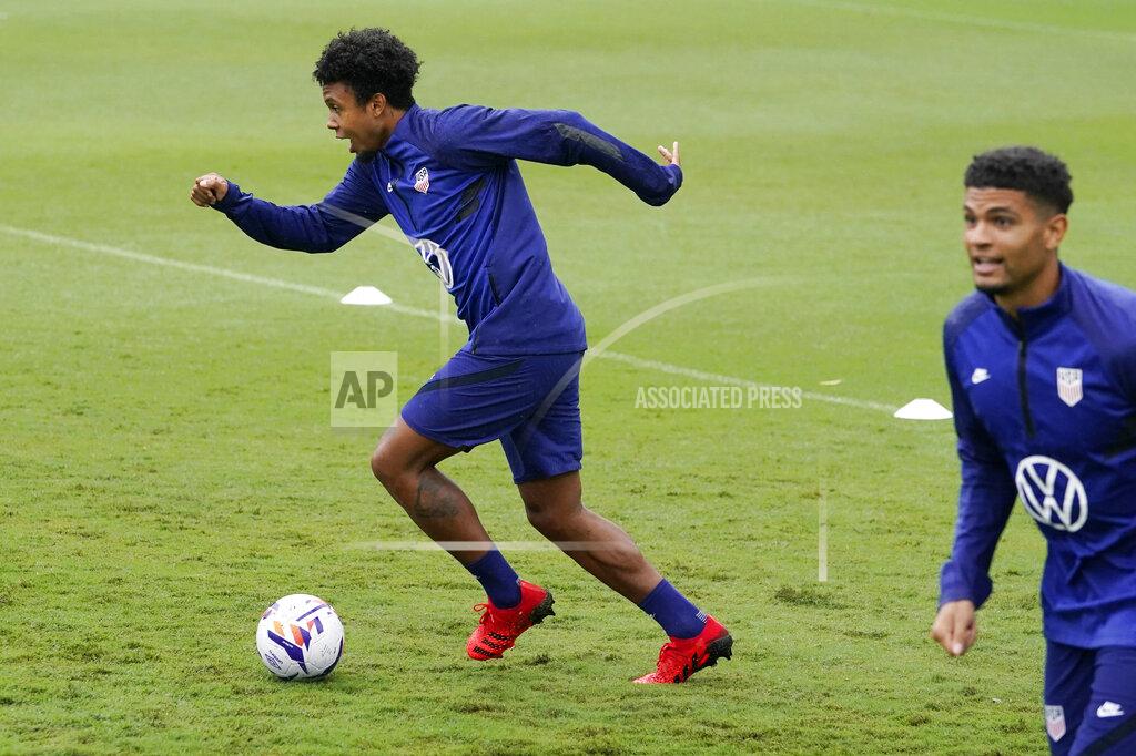 Mark Humphrey Weston McKennie, left, dribbles a ball during soccer practice for the U.S. Men's National Team Tuesday, Aug. 31, 2021, in Nashville, Tenn. (AP Photo/Mark Humphrey)