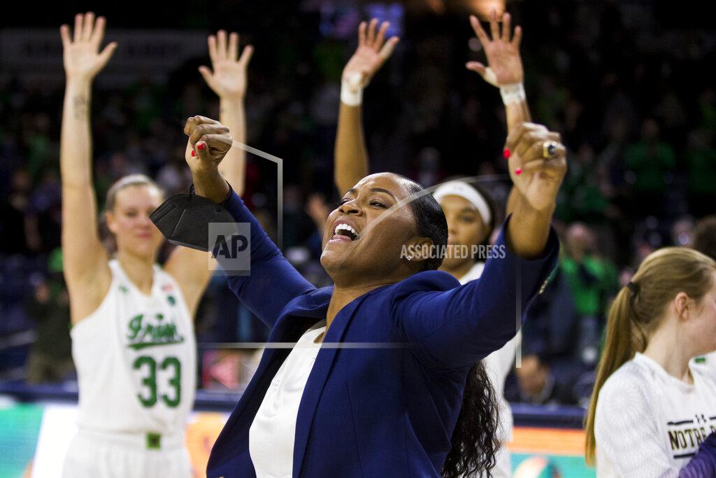 Robert Franklin Notre Dame coach Niele Ivey celebrates with the team following a win over North Carolina State in an NCAA college basketball game Tuesday, Feb. 1, 2022, in South Bend, Ind. (AP Photo/Robert Franklin)