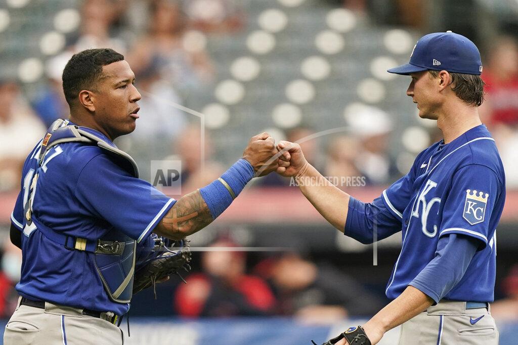 Tony Dejak Kansas City Royals starting pitcher Brady Singer, right, celebrates with catcher Salvador Perez after they defeated the Cleveland Indians in the first baseball game of a doubleheader, Monday, Sept. 20, 2021, in Cleveland. (AP Photo/Tony Dejak)