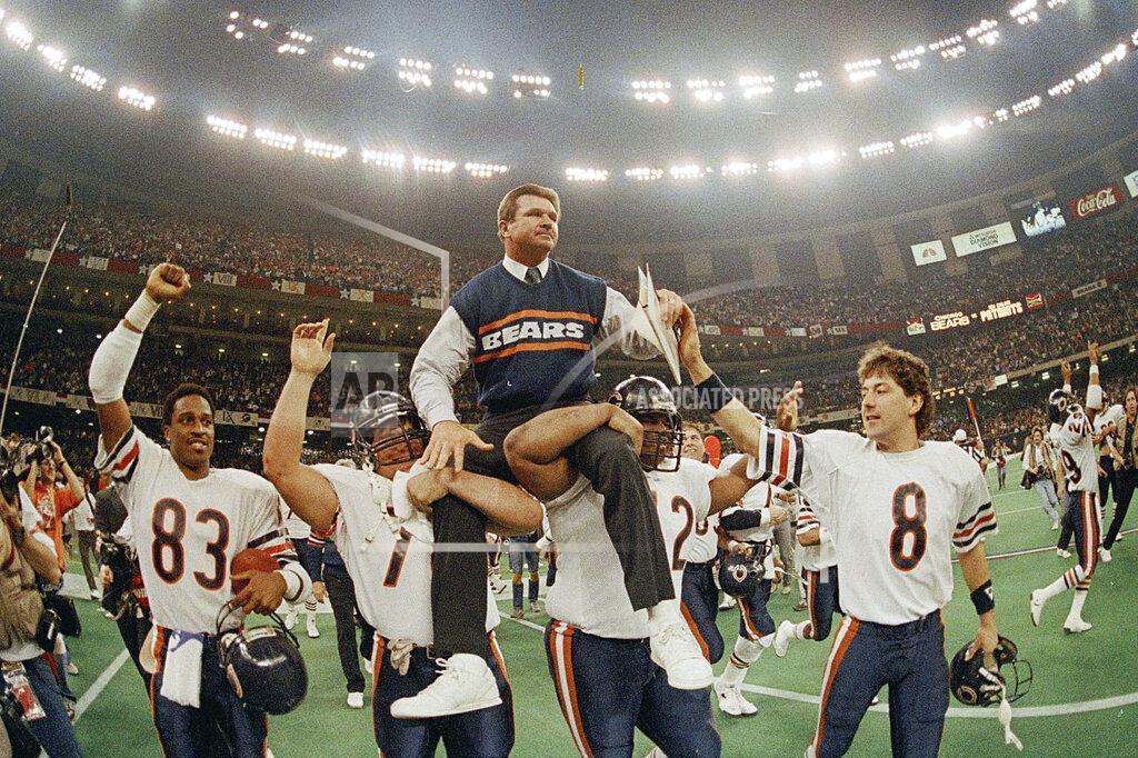 Phil Sandlin FILE- In this Jan. 26, 1986, file photo, Chicago Bears head coach Mike Ditka is carried off the field by Steve McMichael, left, and William Perry after the Bears defeated the New England Patriots 46-10 in Super Bowl XX in New Orleans. (AP Photo/Phil Sandlin, File)