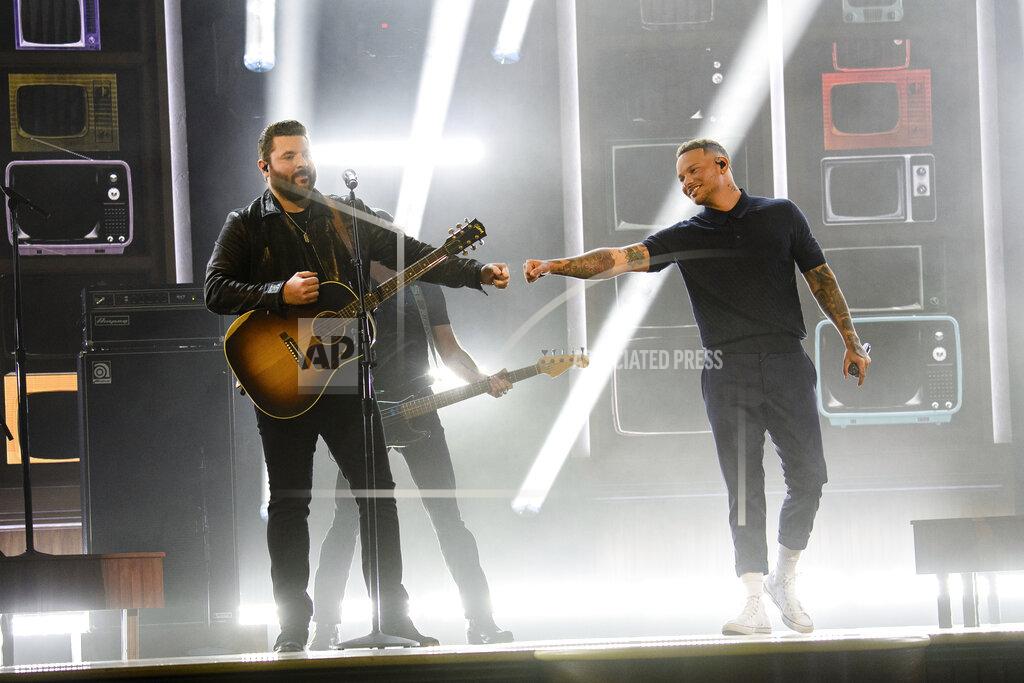 Amy Harris Chris Young, left, and Kane Brown perform at the 56th annual Academy of Country Music Awards on Friday April 16, 2021 at the Ryman Auditorium in Nashville, Tenn. The awards show airs on April 18 with both live and prerecorded segments. (Photo by Amy Harris/Invision/AP)