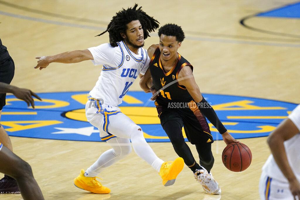 Ashley Landis UCLA guard Tyger Campbell (10) defends against Arizona State guard Alonzo Verge Jr. (11) during the first half of an NCAA college basketball game Saturday, Feb. 20, 2021, in Los Angeles. (AP Photo/Ashley Landis)