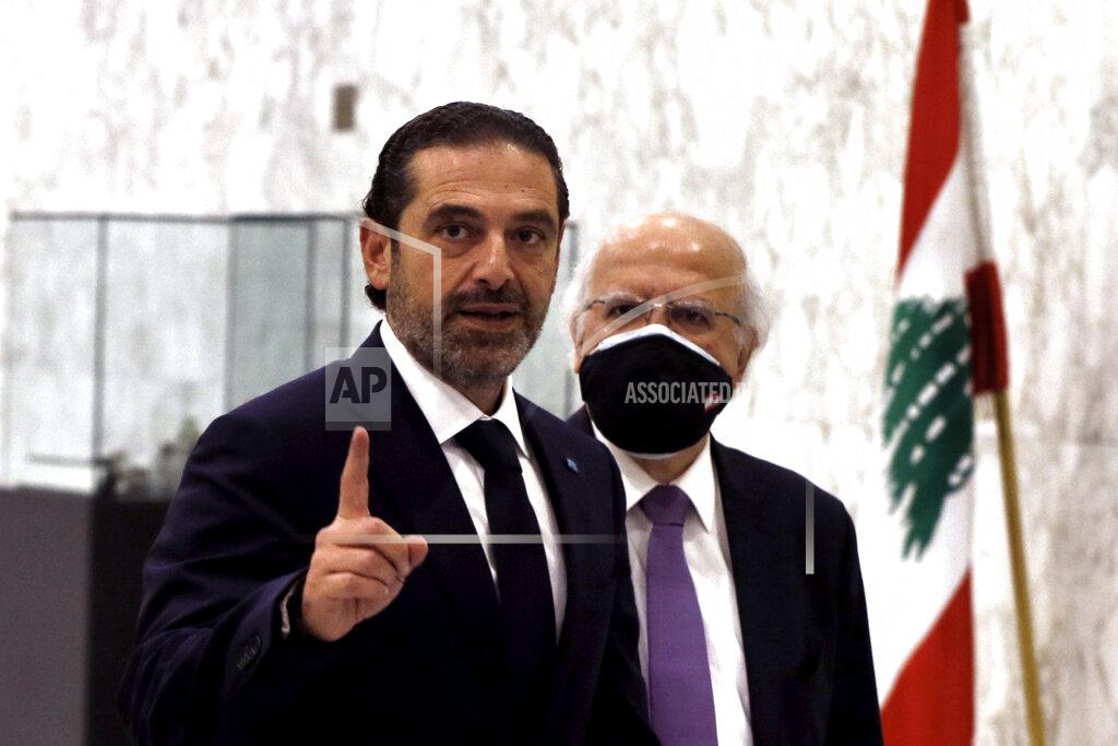 Bilal Hussein Lebanese Prime Minister-Designate Saad Hariri, gestures after his meeting with Lebanese President Michel Aoun, at the Presidential Palace in Baabda, east of Beirut, Lebanon, Thursday, March 18, 2021. Hariri said despite disagreements with the country's president there is still a chance to form a government to halt economic collapse and offer people hope. (AP Photo/Bilal Hussein)