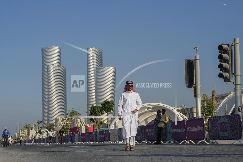 Andre Penner People walk outside the Lusail stadium during a match between Saudi Arabia and Argentina in Lusail, Qatar, Tuesday, Nov. 22, 2022. (AP Photo/Andre Penner)