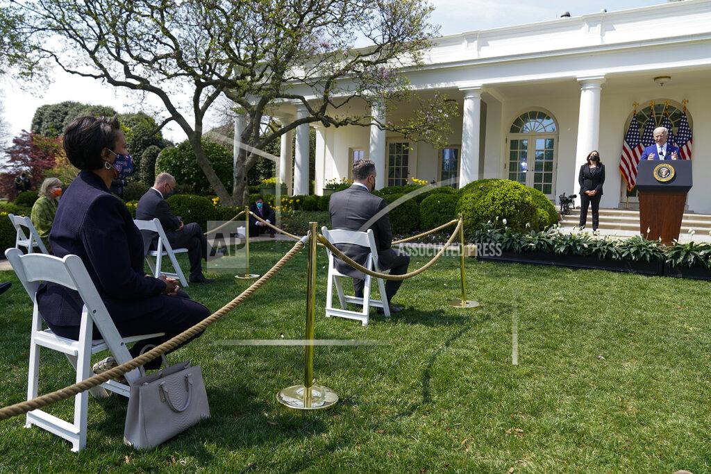 Andrew Harnik District of Columbia Mayor Muriel Bowser, left, listens as President Joe Biden, accompanied by Vice President Kamala Harris, speaks about gun violence prevention in the Rose Garden at the White House, Thursday, April 8, 2021, in Washington. (AP Photo/Andrew Harnik)
