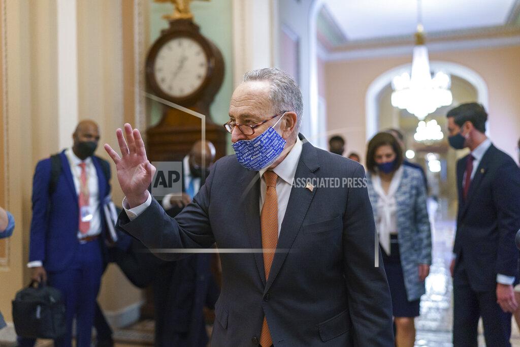 J. Scott Applewhite On the first full day of Democratic control, Senate Majority Leader Chuck Schumer, D-N.Y., walks to the chamber after meeting with new senators from his caucus, at the Capitol in Washington, Thursday, Jan. 21, 2021. (AP Photo/J. Scott Applewhite)