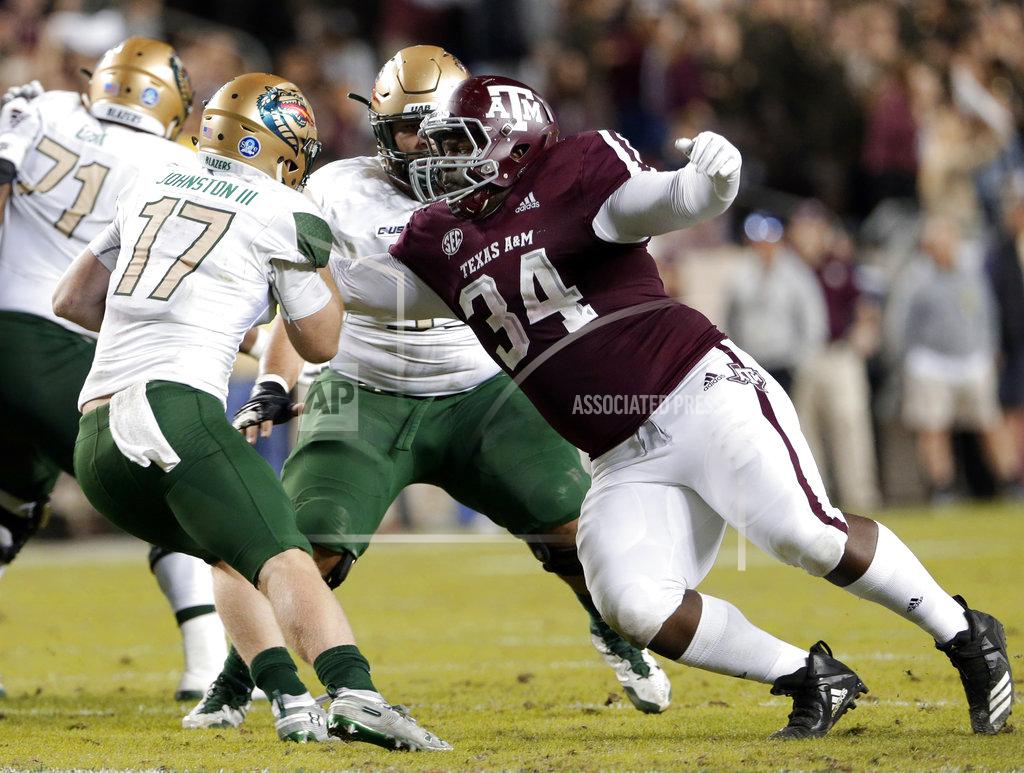 Michael Wyke UAB quarterback Tyler Johnston III (17) is caught for the sack by Texas A&M defensive lineman Daylon Mack (34) during the first half of an NCAA college football game Saturday, Nov. 17, 2018, in College Station, Texas. (AP Photo/Michael Wyke)