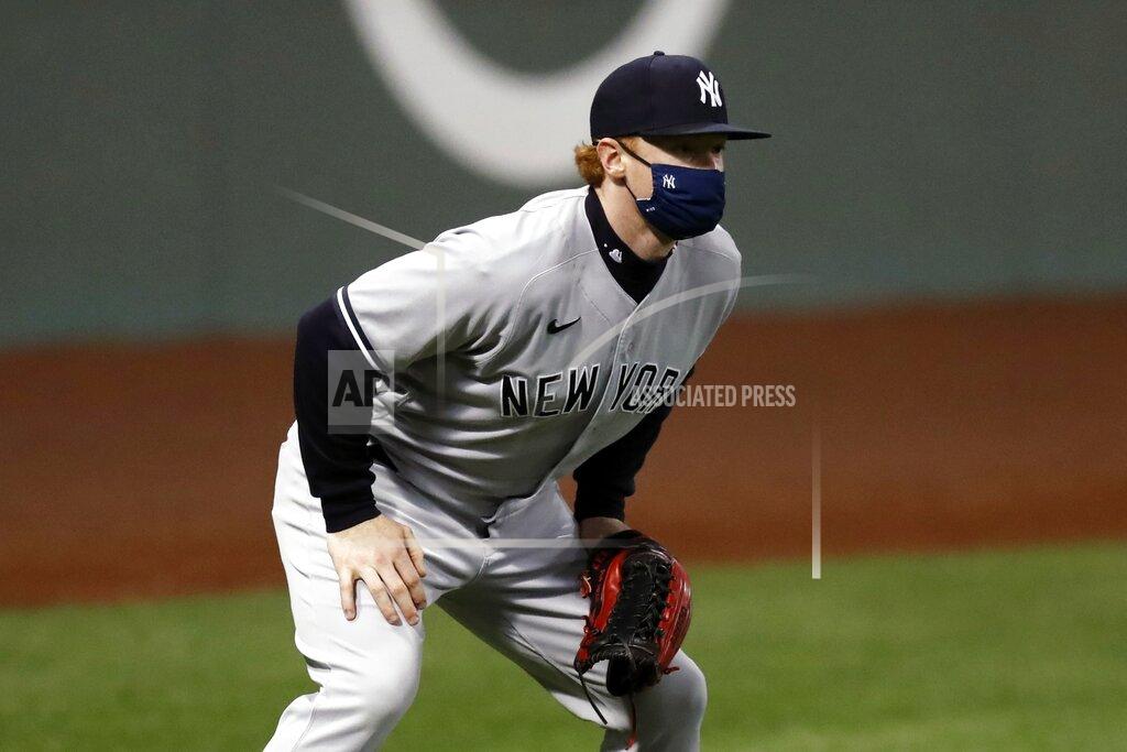 Michael Dwyer New York Yankees' Clint Frazier wears a mask while playing in left field against the Boston Red Sox during the fourth inning of a baseball game Friday, Sept. 18, 2020, in Boston. (AP Photo/Michael Dwyer)