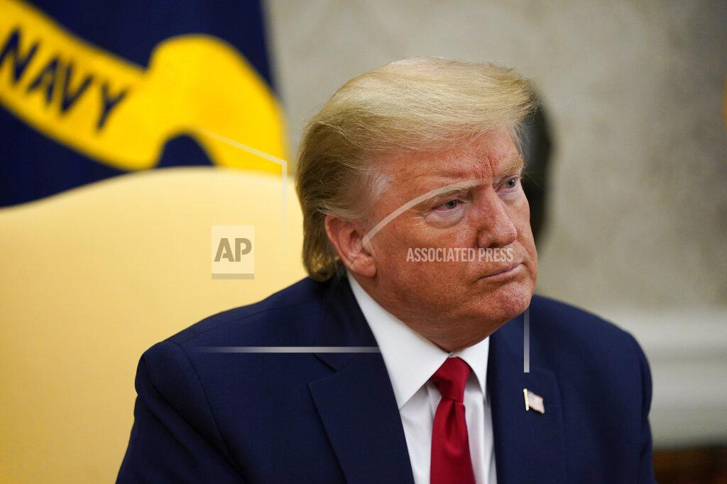 FILE - In this May 7, 2020, file photo President Donald Trump listens during a meeting about the coronavirus response in the Oval Office of the White House in Washington. Trump is hoping to persuade a Supreme Court with two of his appointees to keep his tax and other financial records from being turned over to lawmakers and a New York district attorney. The justices are hearing arguments by telephone Tuesday, May 12. (AP Photo/Evan Vucci, File)
