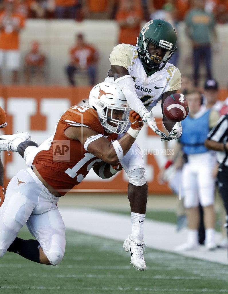 Eric Gay Texas defensive back Brandon Jones (19) breaks up a pass intended for Baylor wide receiver Chris Platt (14) during the second half of an NCAA college football game, Saturday, Oct. 13, 2018, in Austin, Texas. (AP Photo/Eric Gay)