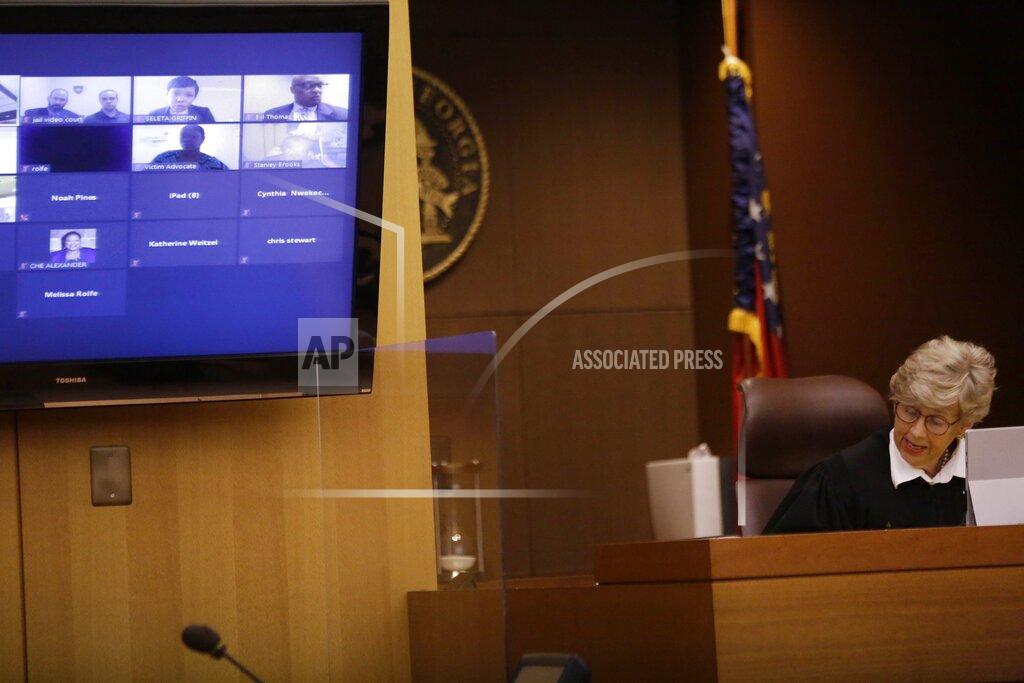 Brynn Anderson Judge Jane C. Barwick speaks during a bond hearing for former Atlanta police officer Garrett Rolfe who appears on a television screen on Tuesday, June 30, 2020, in Atlanta. Rolfe, who fatally shot Rayshard Brooks can be free on bond while his case is pending. A judge set a bond of $500,000 for Rolfe, who faces charges including felony murder in the killing of the 27-year-old Black man. Rolfe fatally shot Brooks in the back when Brooks fired a Taser in his direction while running away after a struggle on June 12. (AP Photo/Brynn Anderson, Pool)