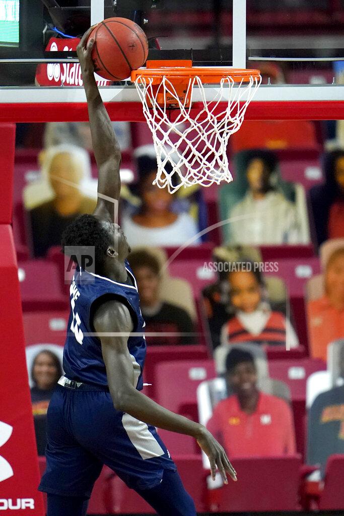 Julio Cortez St. Peter's forward Fousseyni Drame fails a dunk attempt against Maryland during the first half of an NCAA college basketball game, Friday, Dec. 4, 2020, in College Park, Md. (AP Photo/Julio Cortez)