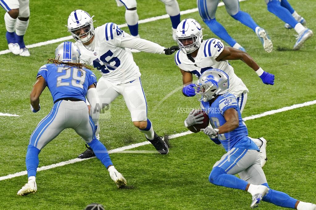 Carlos Osorio Detroit Lions running back Adrian Peterson, right, rushes during the second half of an NFL football game against the Indianapolis Colts, Sunday, Nov. 1, 2020, in Detroit. (AP Photo/Carlos Osorio)
