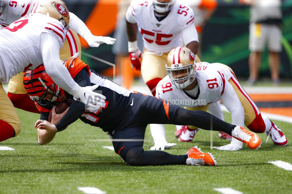 Gary Landers Cincinnati Bengals quarterback Andy Dalton (14) is sacked by San Francisco 49ers defensive end Arik Armstead (91) during the first half an NFL football game, Sunday, Sept. 15, 2019, in Cincinnati. (AP Photo/Gary Landers)